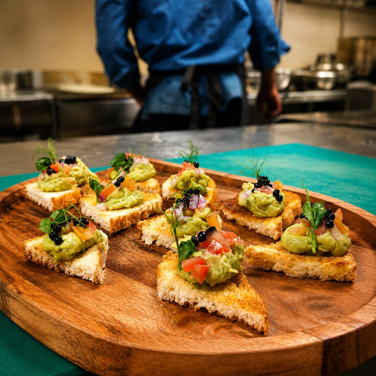 Avocado toast points arranged on a serving board